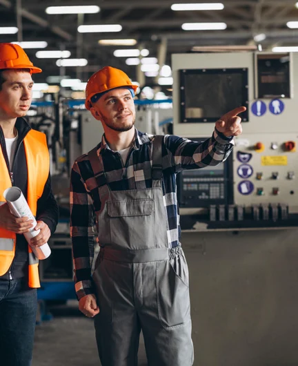 e2716b74-4b39-4b85-bc68-93bb8cdd5567-two-colleagues-factory.jpg